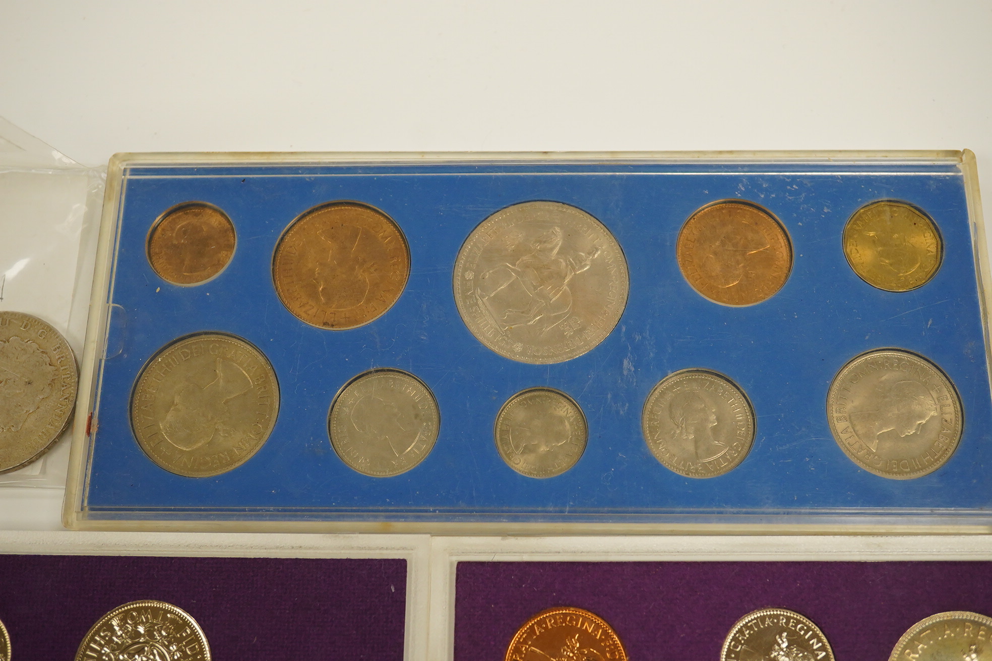 A small collection of coins including two 1970 proof sets, a 1953 set, a George III crown, a 1933 George V crown and a medallion for the Argyle Chapel, Bath. Condition - fair